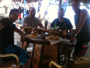 burger et coconut water on the beach